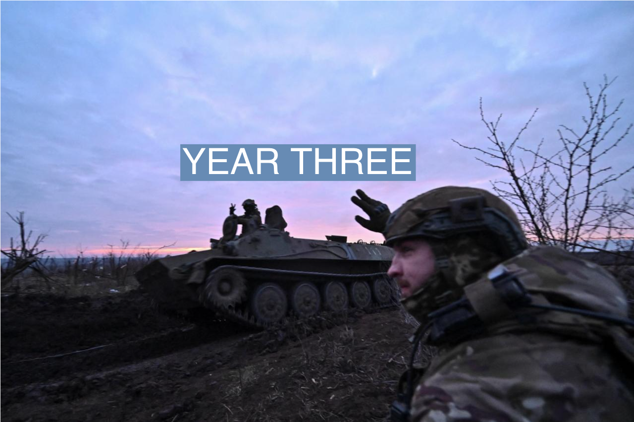 A Ukrainian serviceman of the 65th Mechanised Brigade of the Ukrainian Armed Forces salutes his brother-in-arms who rides atop an armoured personnel carrier near the front line village of Robotyne, amid Russia’s attack on Ukraine, in the Zaporizhzhia region on Feb. 21, 2024.