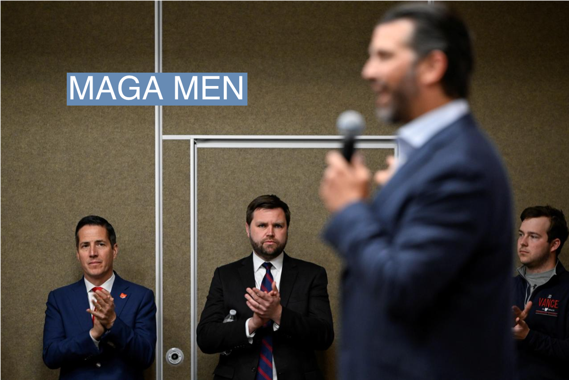 Former Republican senate candidate Bernie Moreno and current Republican senate candidate JD Vance listen to Donald Trump Jr. speaking at a Vance campaign event in Ohio on April 20, 2022.