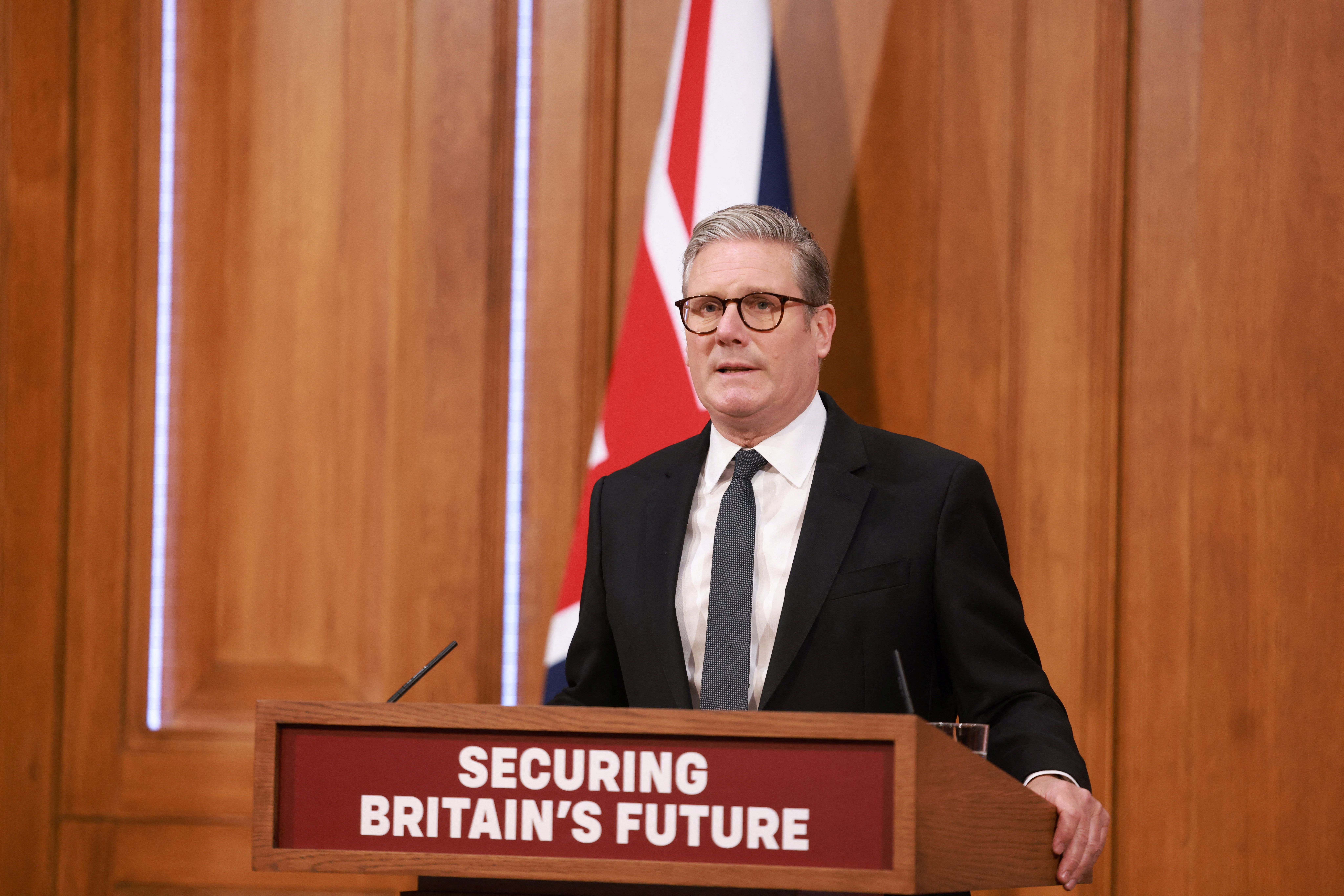 Britain’s Prime Minister Keir Starmer delivers remarks at a press conference on migration, in London.