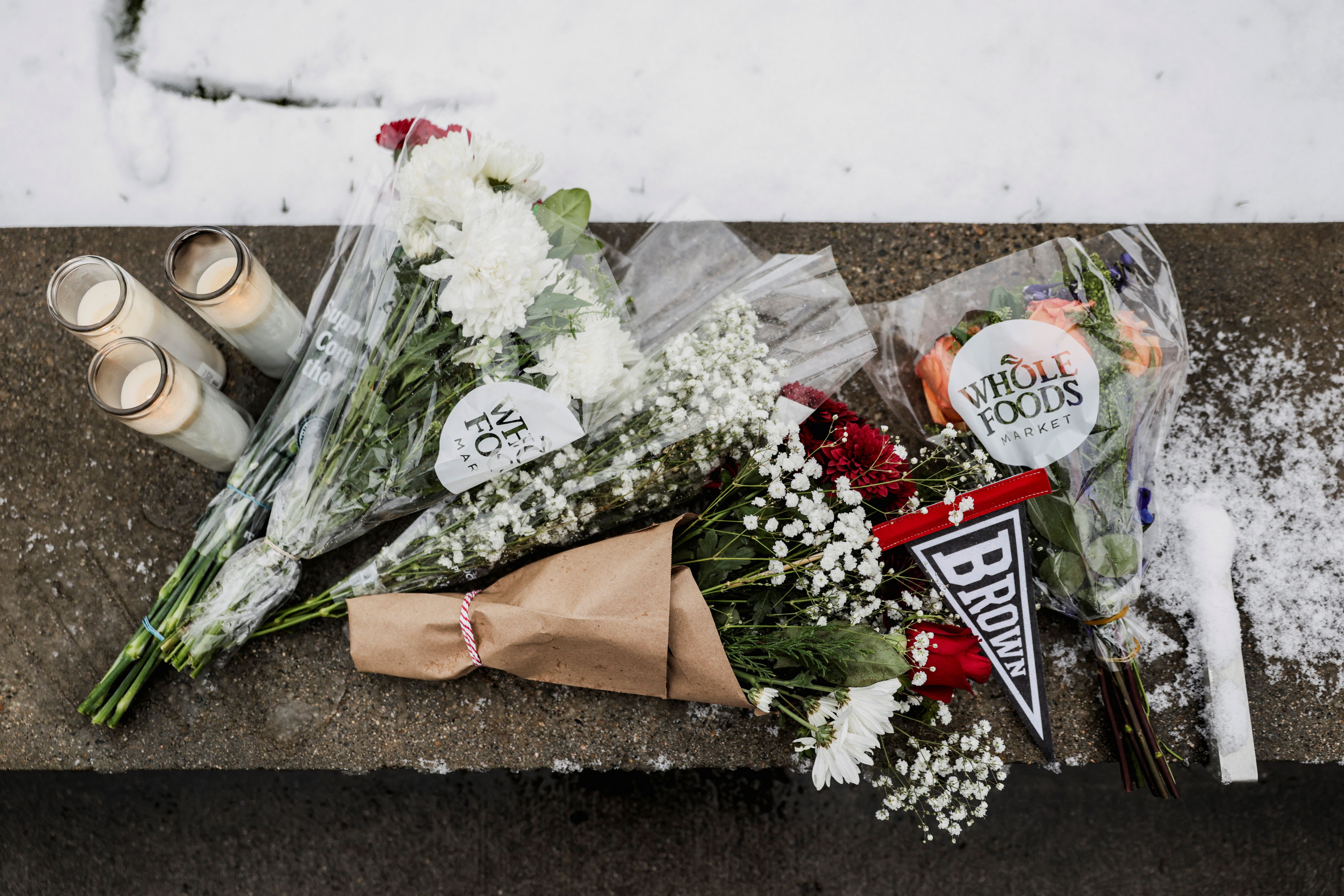 Flowers left at the site of the Brown University shooting
