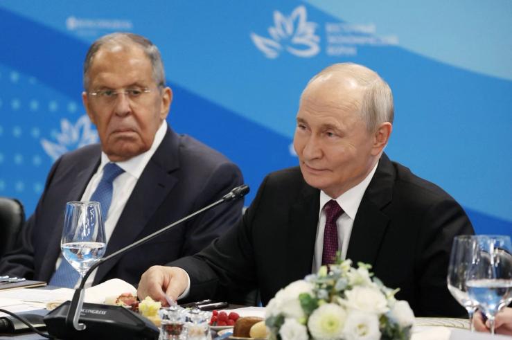 Russia’s foreign minister Sergei Lavrov and President Vladimir Putin.