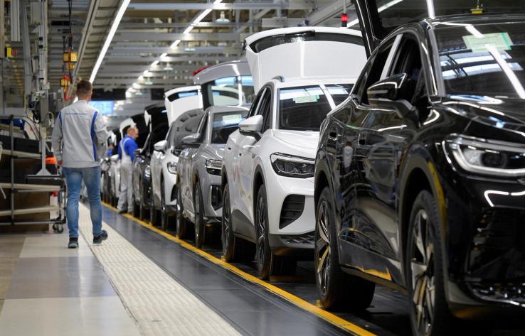 Technicians work at the production line for electric car models of the Volkswagen Group in Zwickau, Germany.