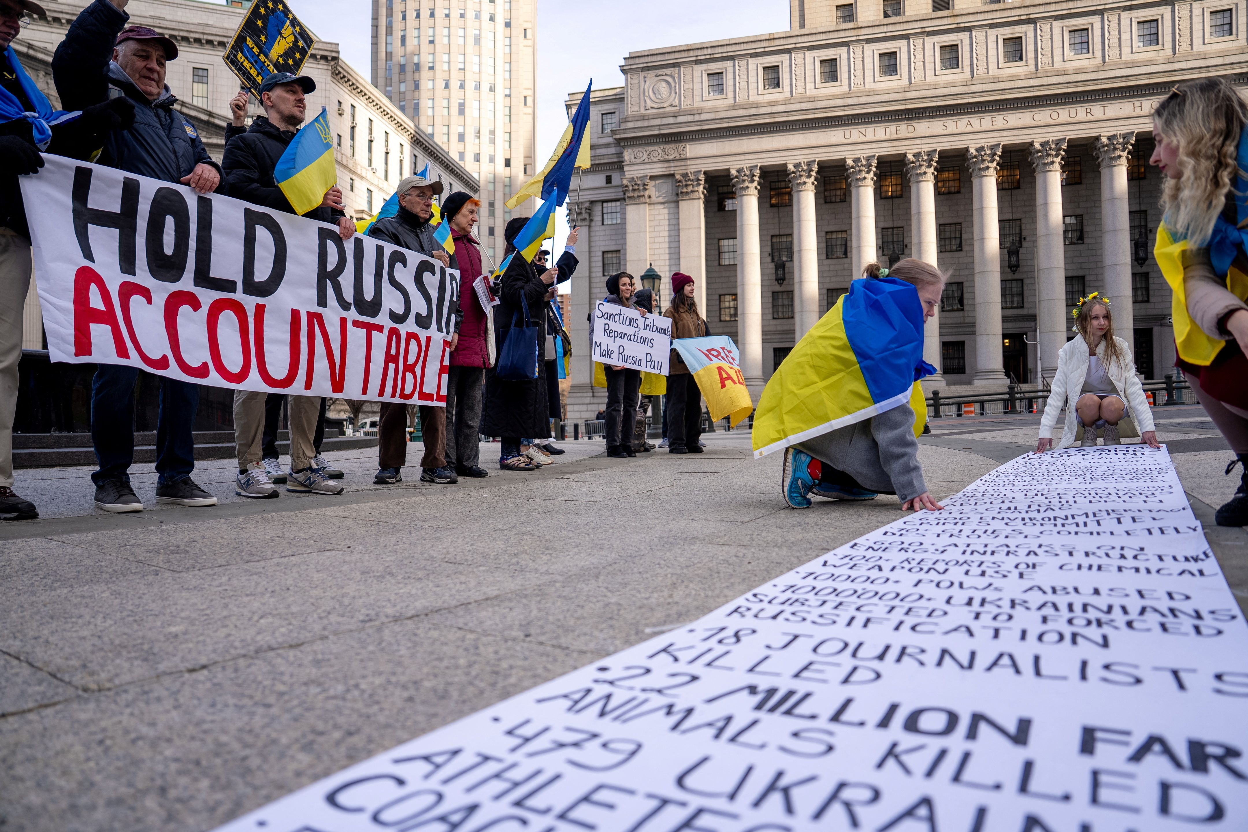 People attend a “Hold Russia Accountable Rally” in New York City, U.S.,