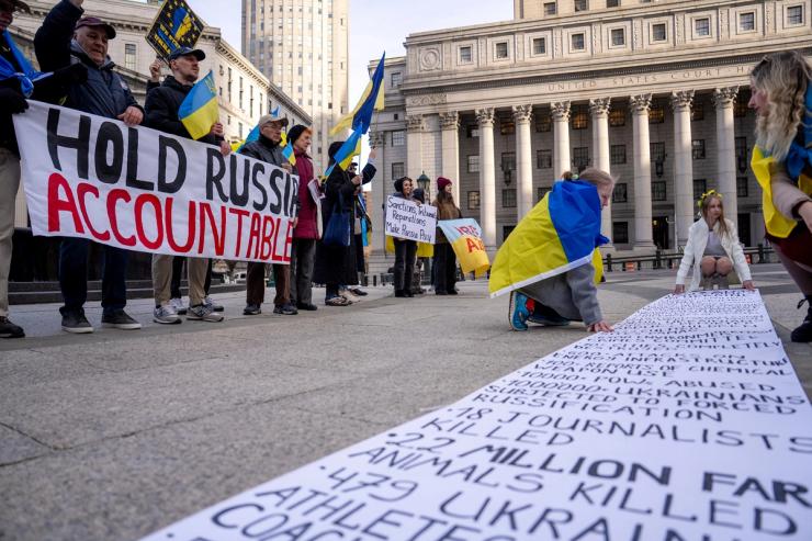 People attend a “Hold Russia Accountable Rally” in New York City, U.S.,