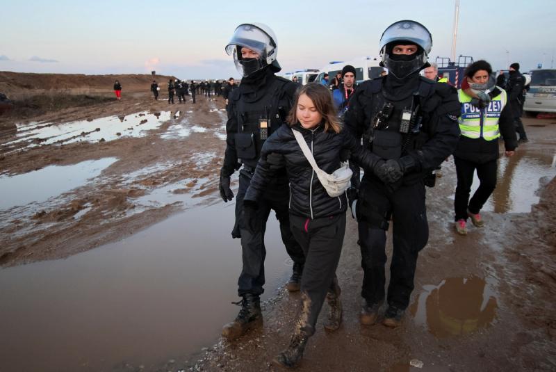 Police officers detain climate activist Greta Thunberg on the day of a protest against the expansion of the Garzweiler open-cast lignite mine of Germany’s utility RWE to Luetzerath, in Germany, January 17, 2023.