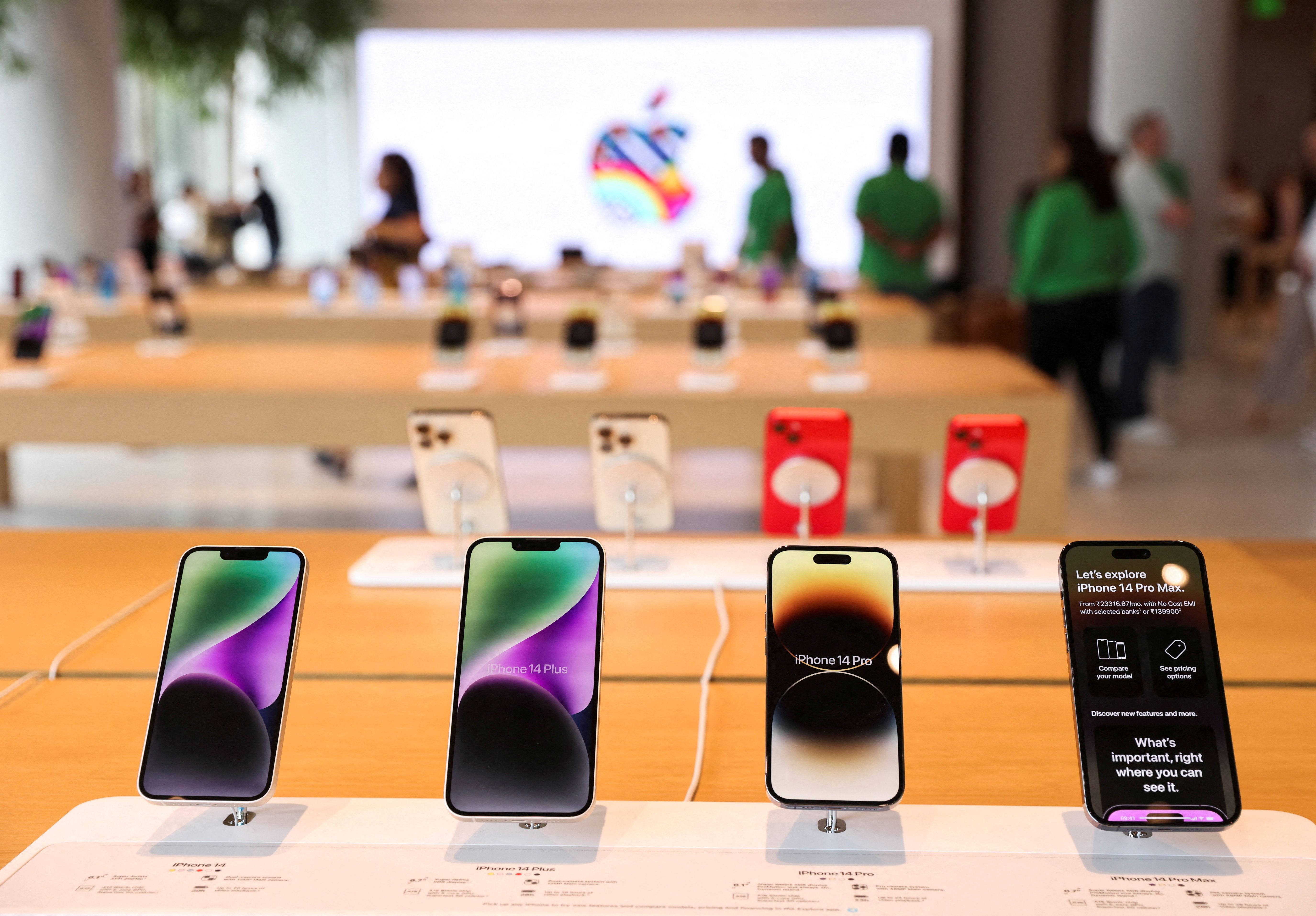Apple iPhones are seen inside India’s first Apple retail store during a media preview, a day ahead of its launch in Mumbai.