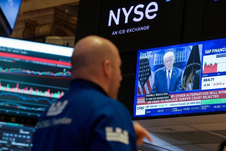 Stock traders watch Trump on TV