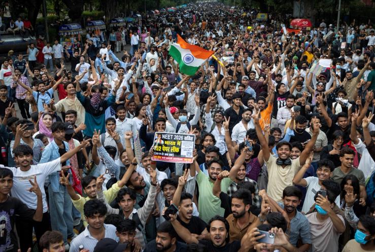 Supporters of India’s Cockroach Janta Party celebrate after India’s Education Minister Dharmendra Pradhan resigned