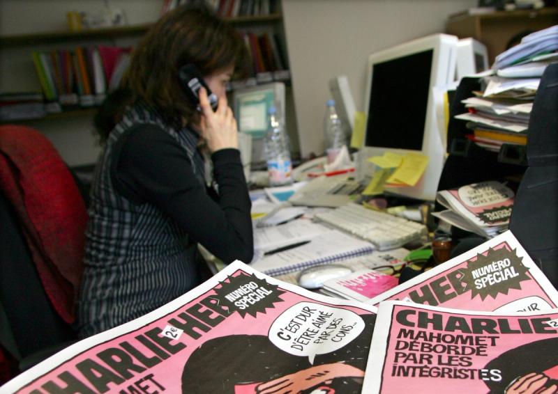 Copies of the French satirical weekly “Charlie Hebdo” seen in their Paris newsroom.
